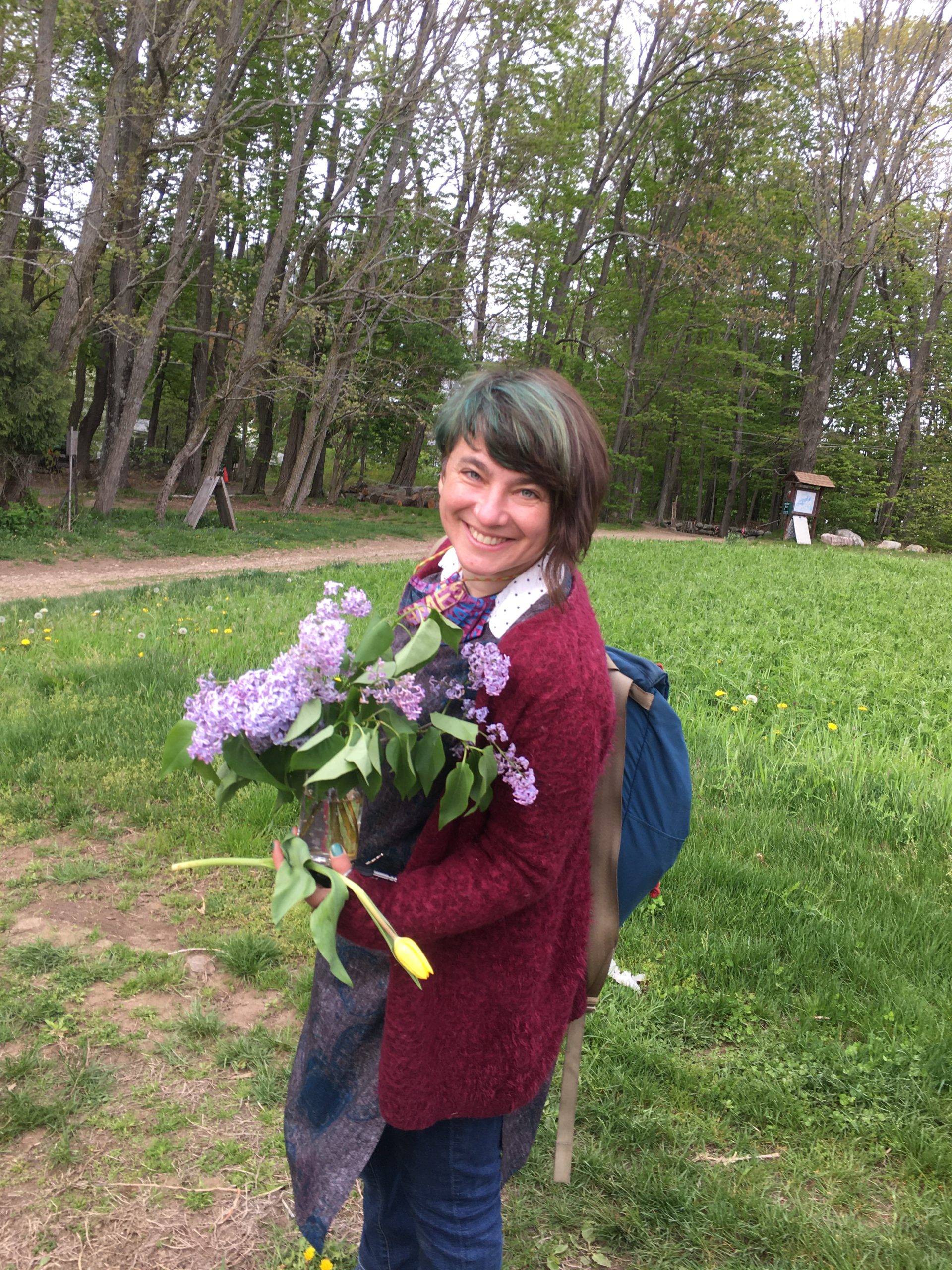 Szuji holding lilacs